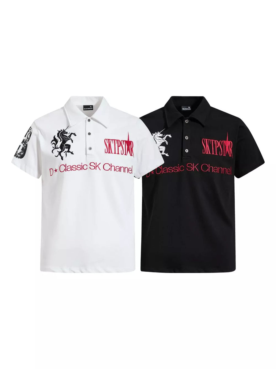 White and black cotton polos with embroidered mythical creatures and text details.