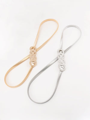 Gold and silver elastic waist belts with intertwined knot detail