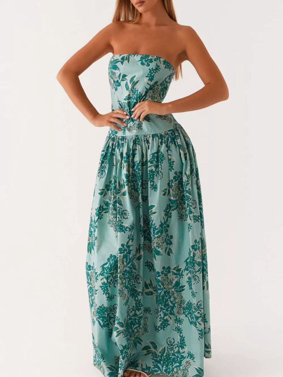 Turquoise floral printed strapless maxi dress with a gathered waist and full skirt.