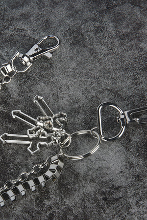 Silver geometric chain waist accessory with crossed charms and lobster clasps.