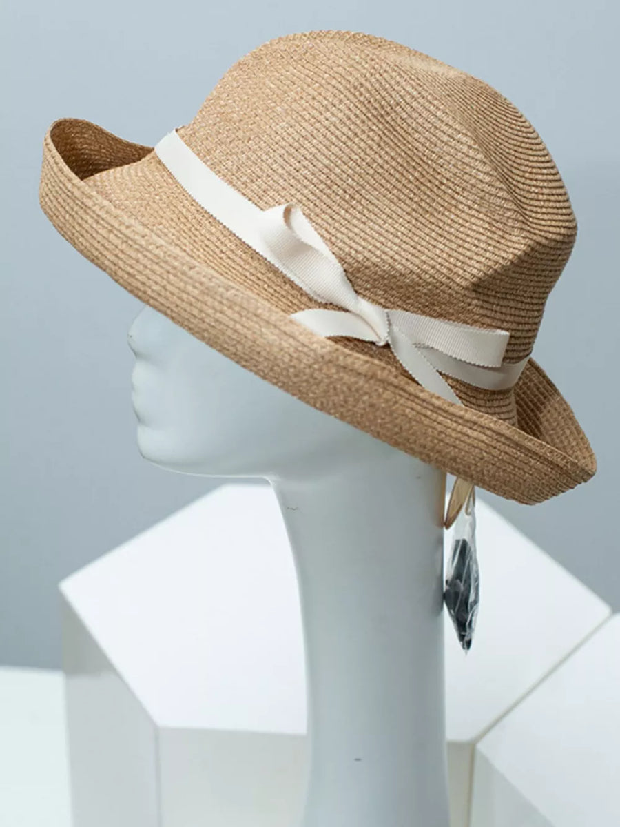 Beige straw sun hat with white ribbon bow detail