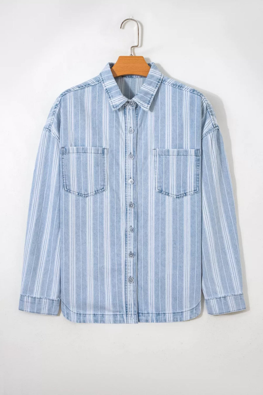 Relaxed blue and white striped denim shacket with two chest pockets and button-down front.