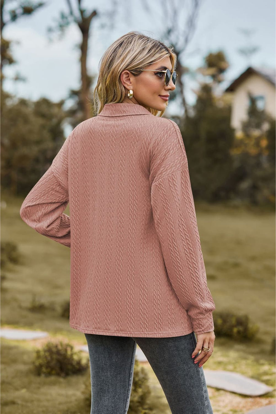 Textured knit polo shirt in Dusty Pink with a collared neckline and long sleeves.
