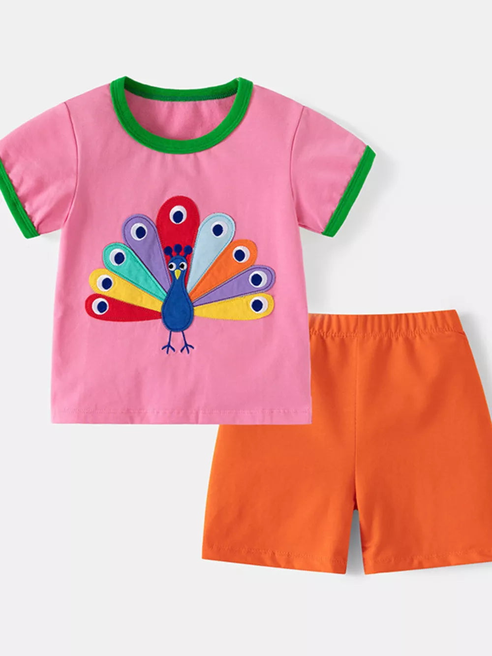 Pink cotton toddler set with peacock embroidery and orange shorts