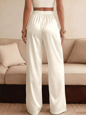 White satin high-waist wide-leg maternity pants with elastic waistband.