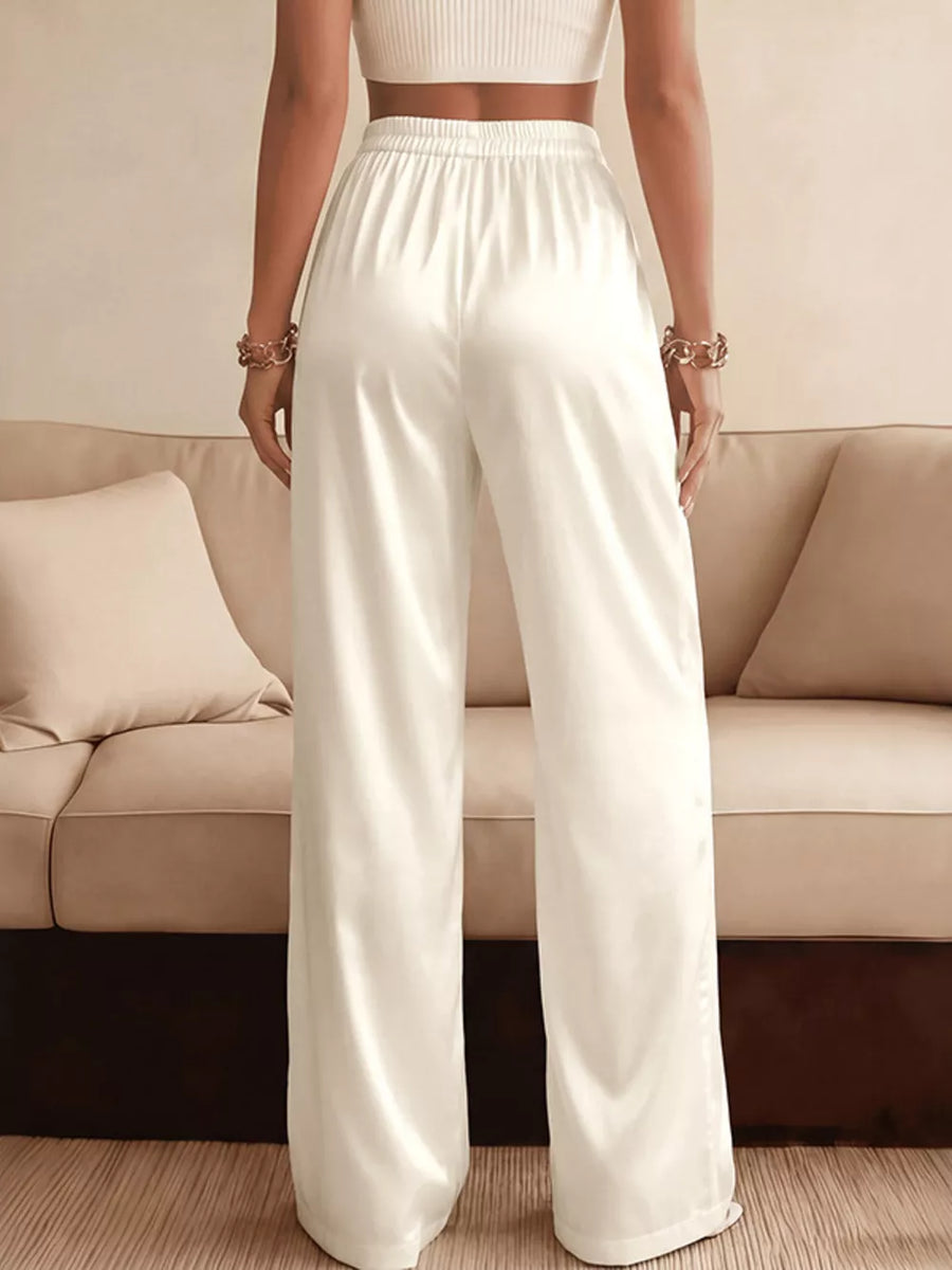 White satin high-waist wide-leg maternity pants with elastic waistband.