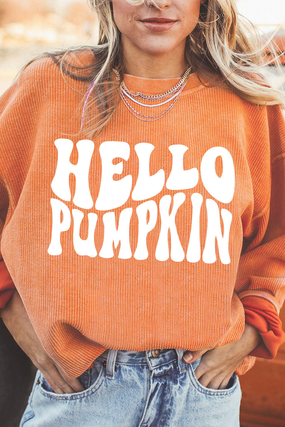 Caramel corduroy sweatshirt with white "Hello Pumpkin" graphic print.