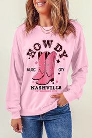 Blush pink crewneck sweatshirt with Nashville graphic and cowboy boots.