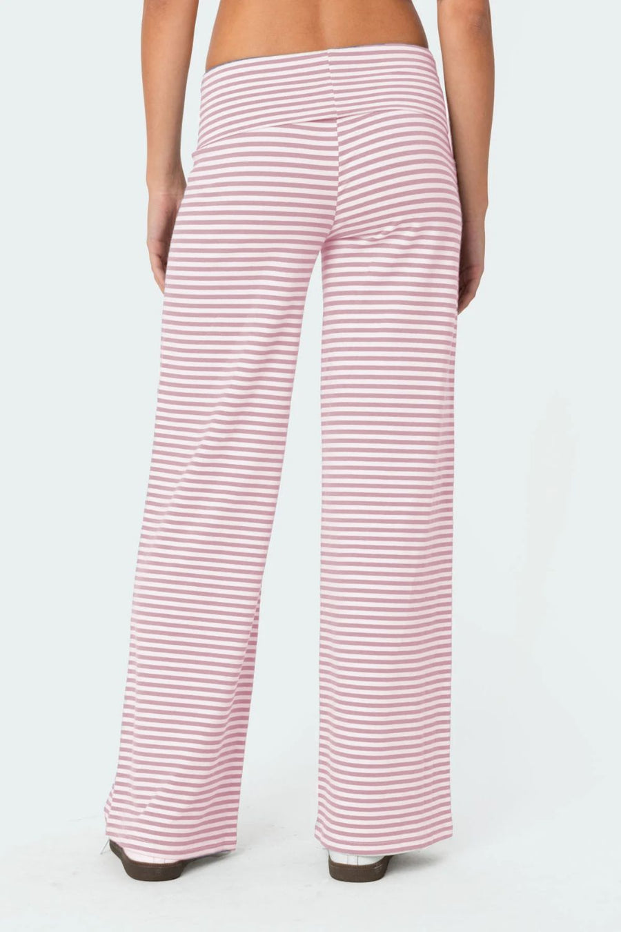 Blush pink and white striped palazzo pants with a high waist.