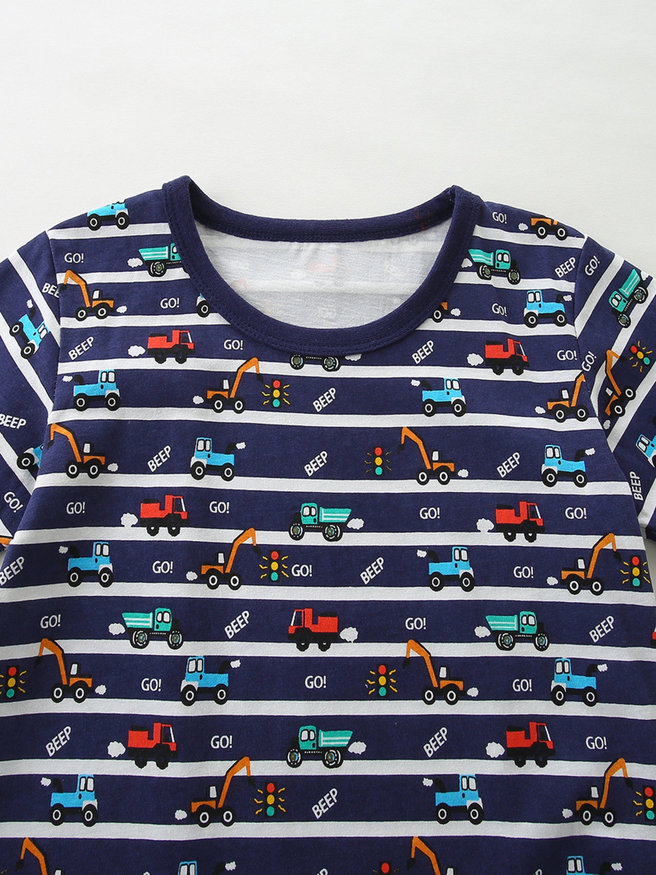Navy cotton baby set with playful vehicle print and white stripes.