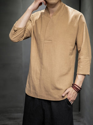 Men's tan 3/4 sleeve V-neck shirt with button detail on sleeve