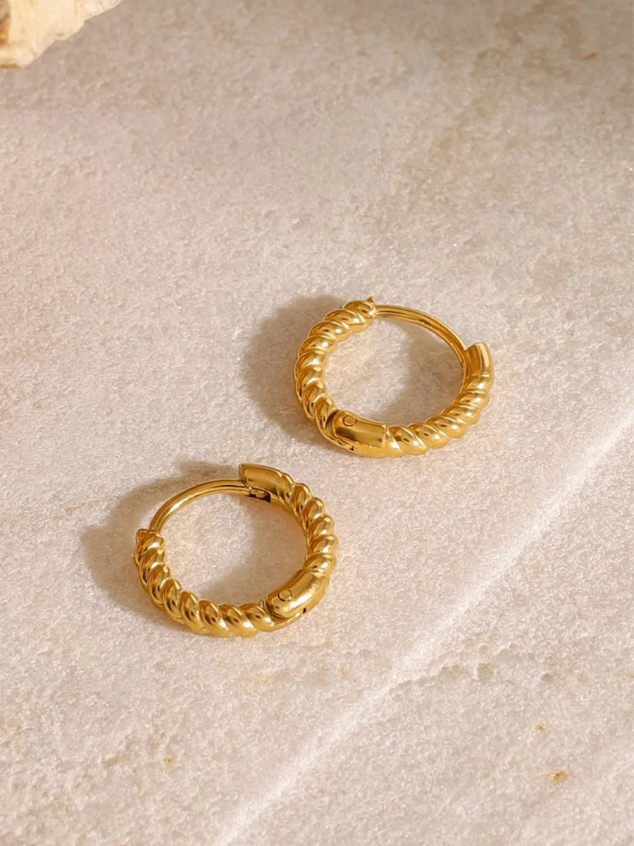Gold twisted mini hoop earrings with a textured rope design.