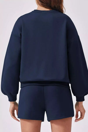 Dark blue sweatshirt with balloon sleeves and matching shorts, comfortable loungewear set.