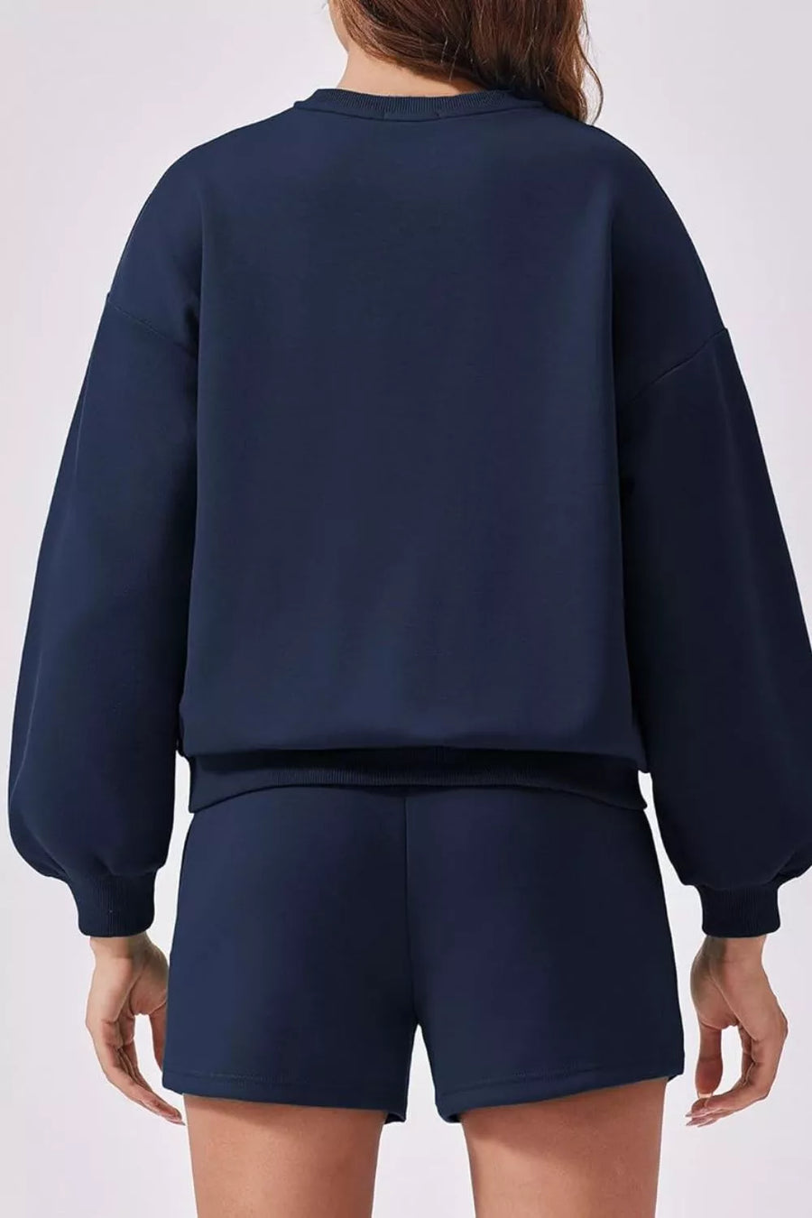 Dark blue sweatshirt with balloon sleeves and matching shorts, comfortable loungewear set.