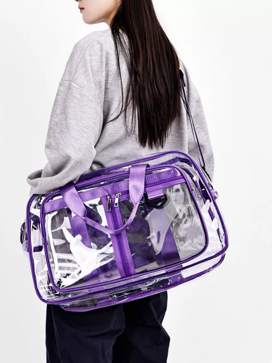 Clear duffel bag with purple trim and handles, featuring a mesh panel and floral print.