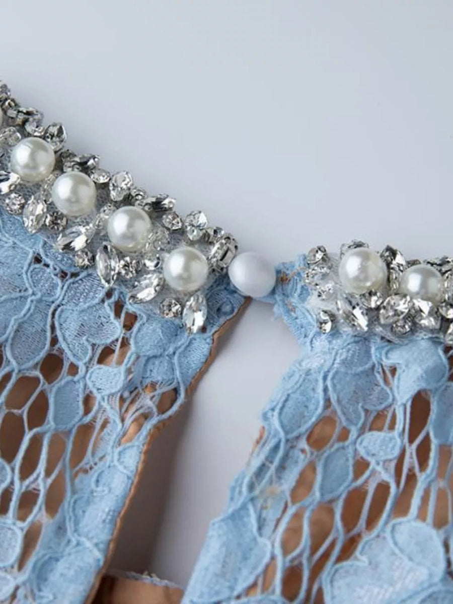 Blue lace dress with pearl and crystal embellished neckline detail.