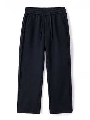 Black relaxed fit men's sweatpants with drawstring and side stripe detail.