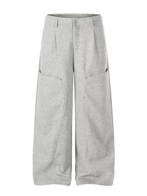 Sophisticated gray wide-leg men's sweatpants with large front pockets and a relaxed fit.