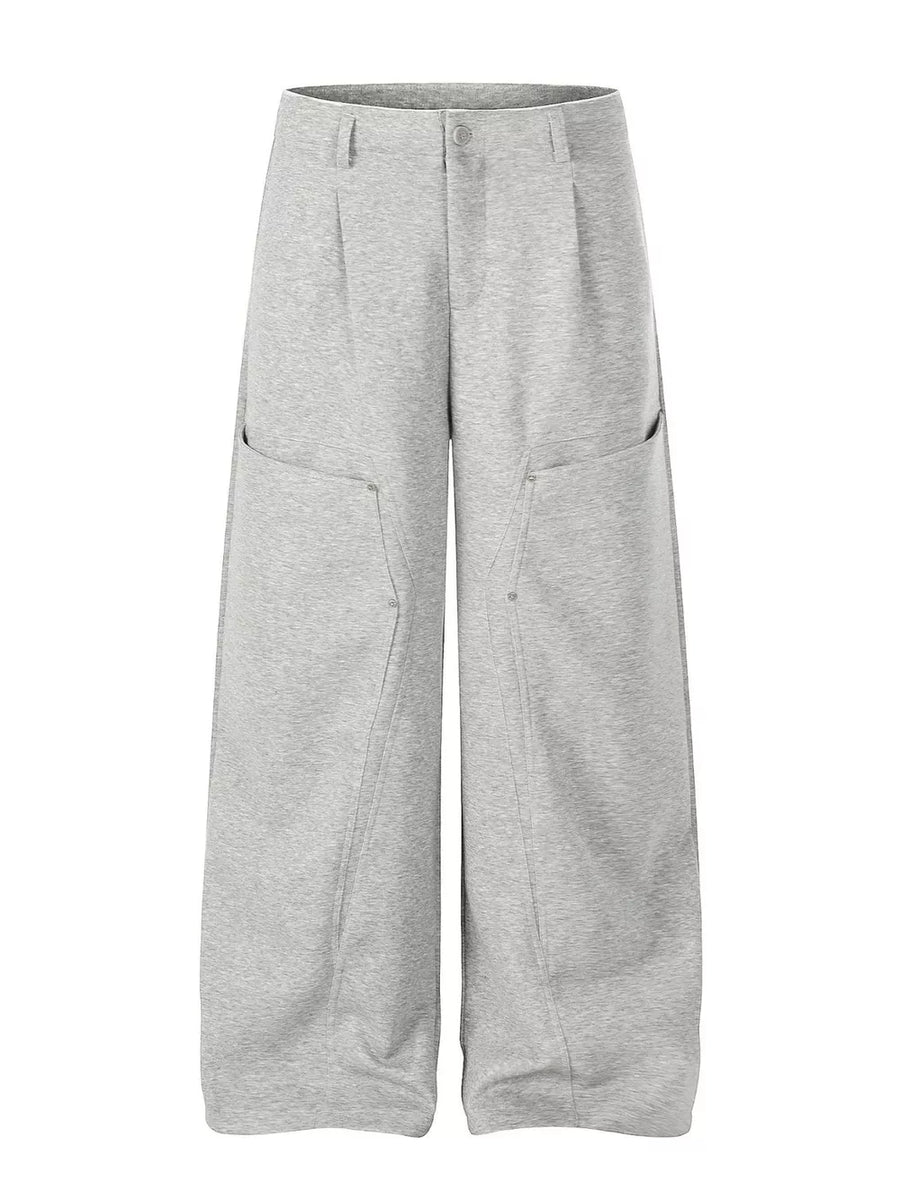 Sophisticated gray wide-leg men's sweatpants with large front pockets and a relaxed fit.