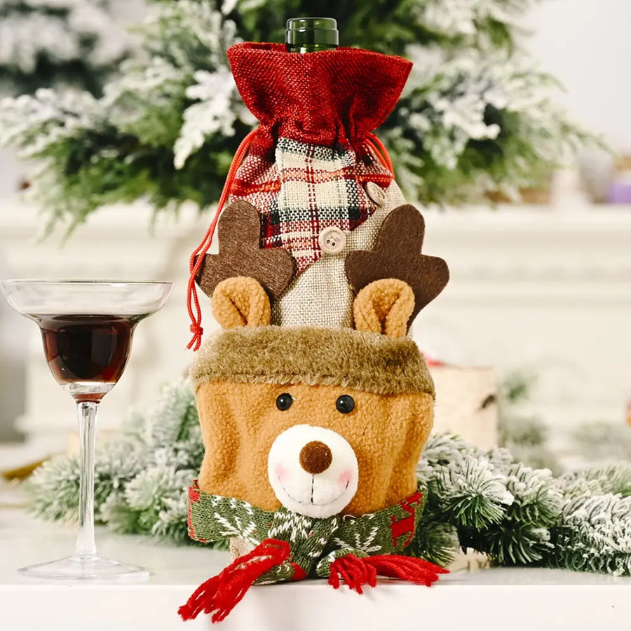 Holiday wine bottle cover with reindeer face, plaid fabric top, and red scarf detail.