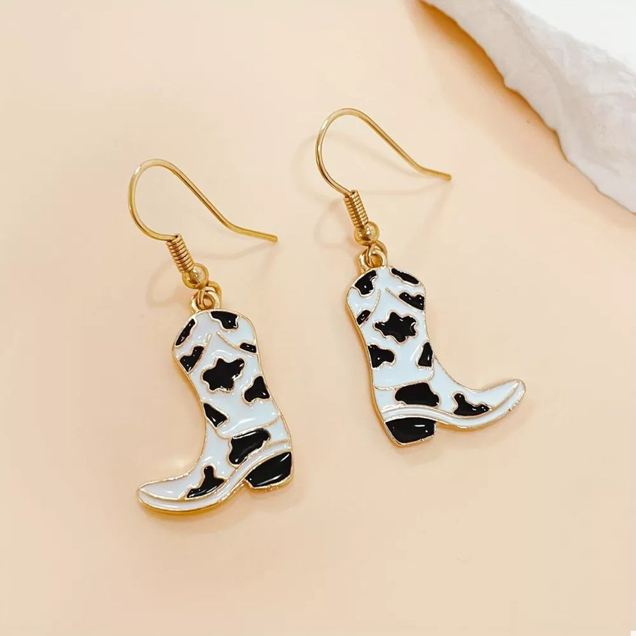 black earrings featuring dangle and cow print