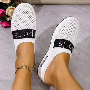 White mesh sportswear mules with air cushion sole and black "SPORTS" band