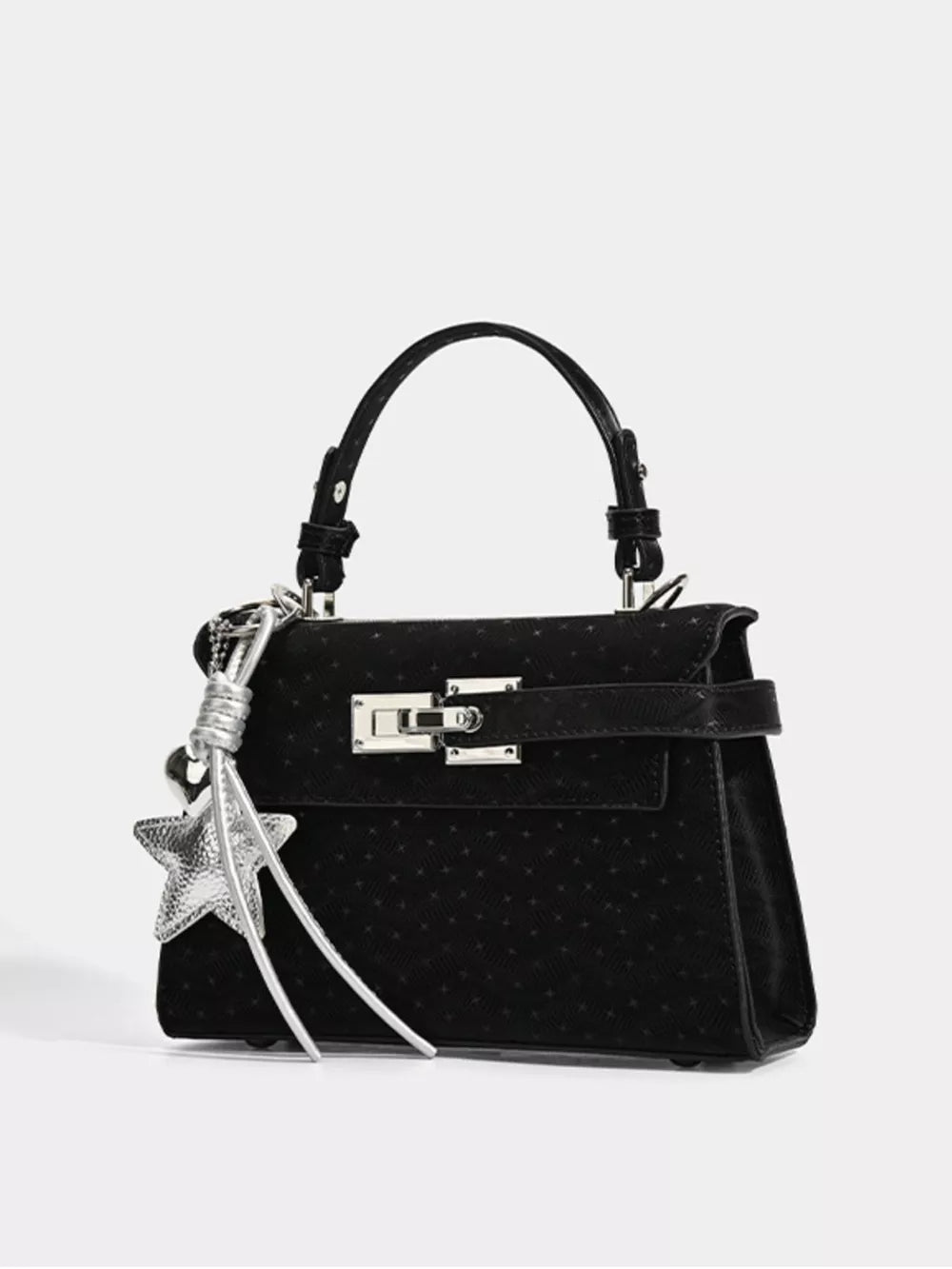 Chic mini tote bag in black faux leather with silver buckle and star charm.