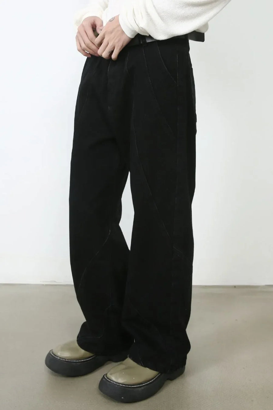 Sculpted seam dark denim trousers with a relaxed fit.