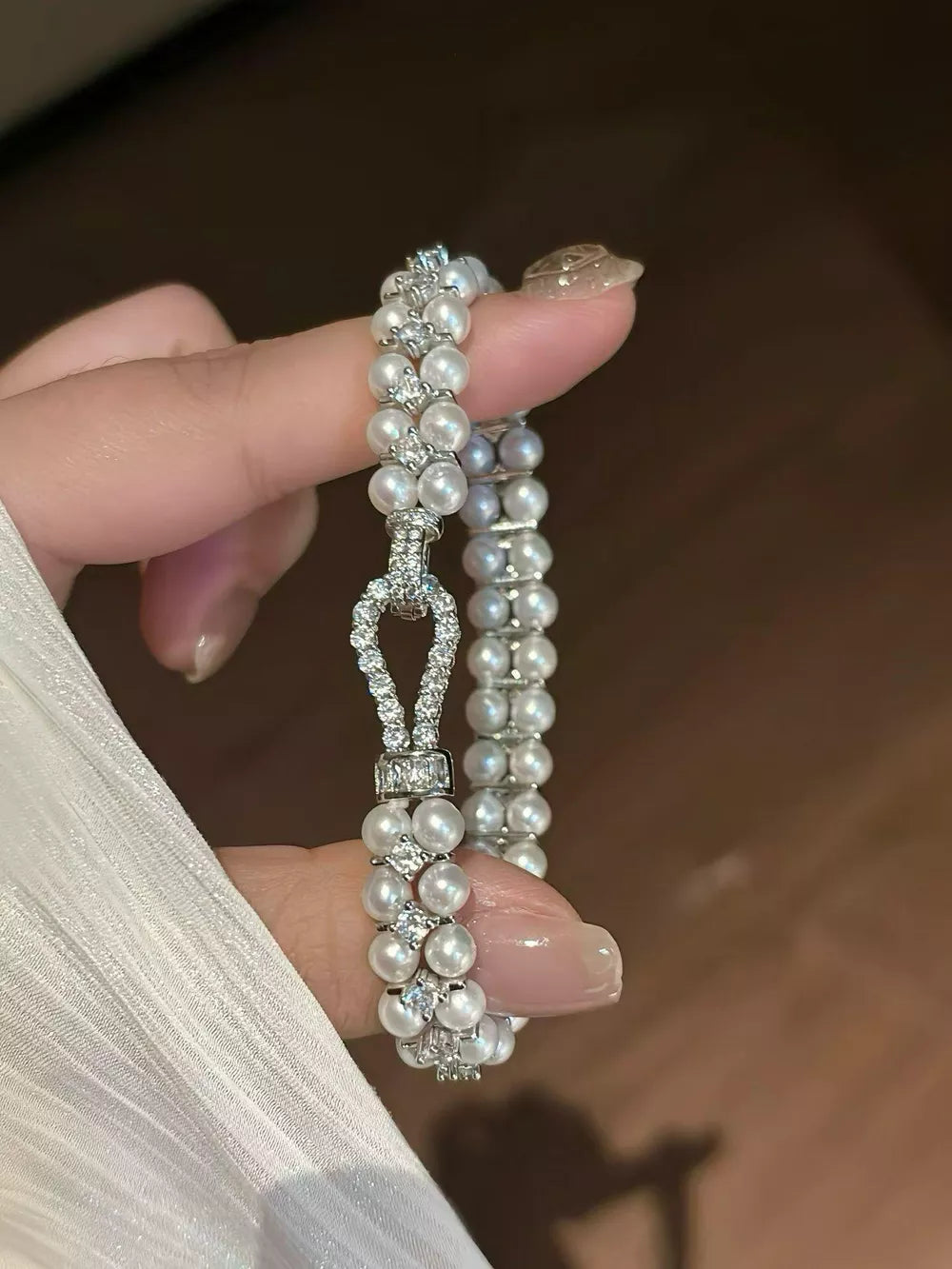 bracelet in ivory featuring pearl embellishment and fitted fit