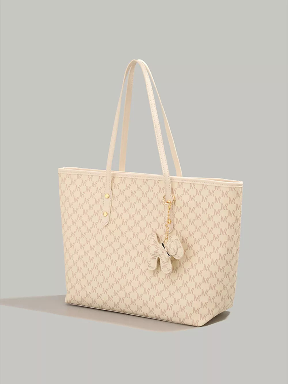 Ivory monogram tote bag with dog charm and double straps