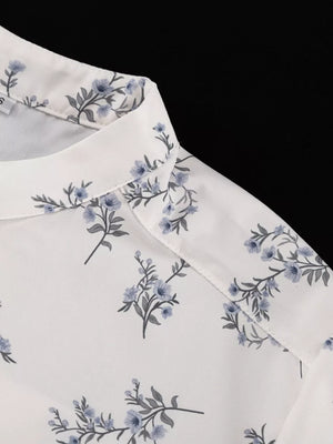 White blouse with blue floral print and spread collar