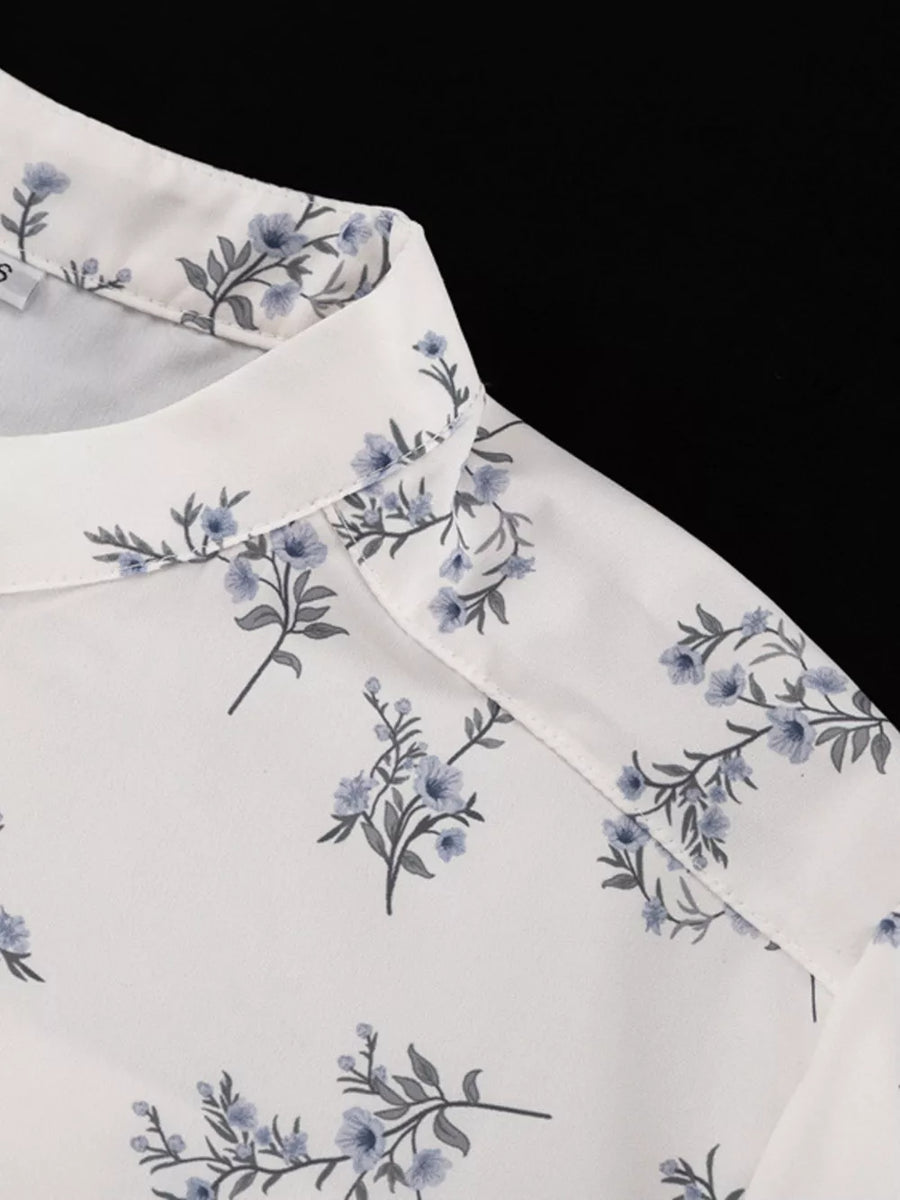White blouse with blue floral print and spread collar