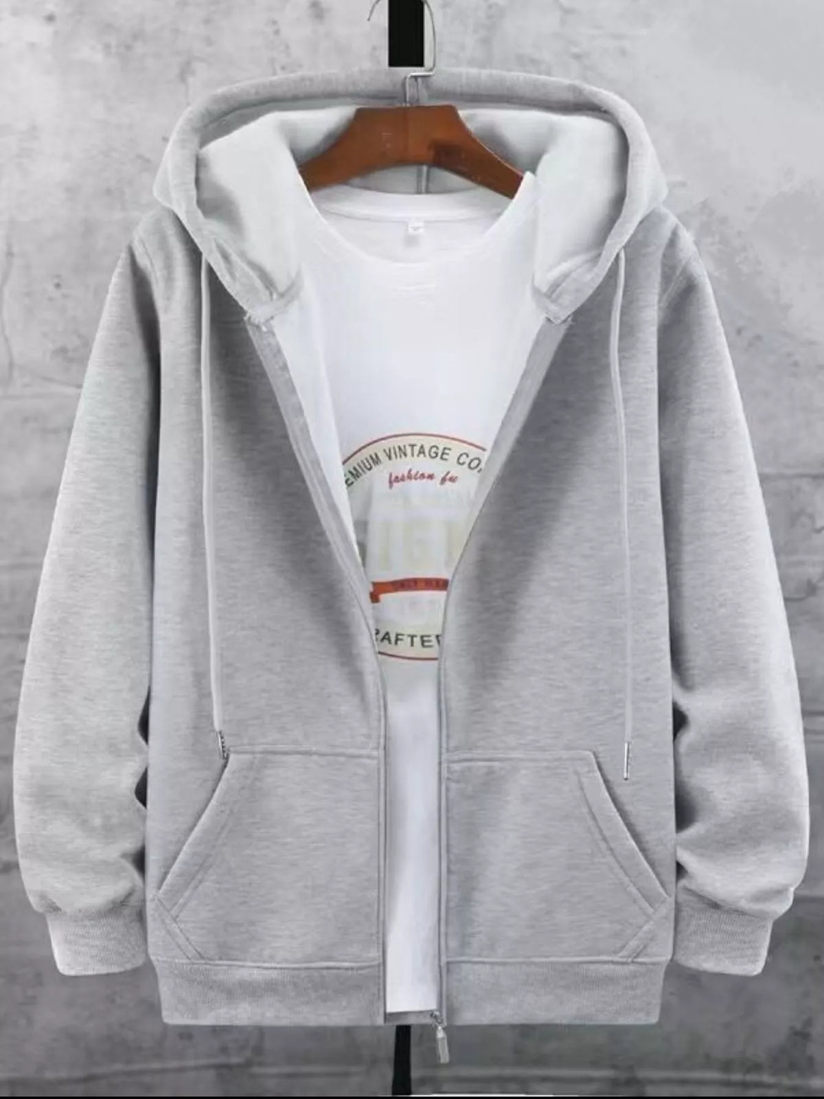 Gray fleece-lined zip-up hoodie with a white graphic t-shirt underneath.