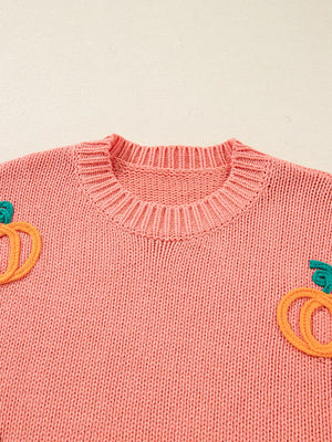 Burnt Coral knit sweater with embroidered pumpkins and a crew neckline.