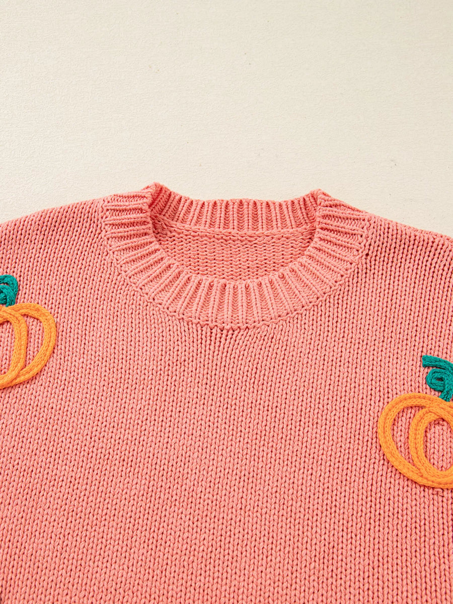 Burnt Coral knit sweater with embroidered pumpkins and a crew neckline.
