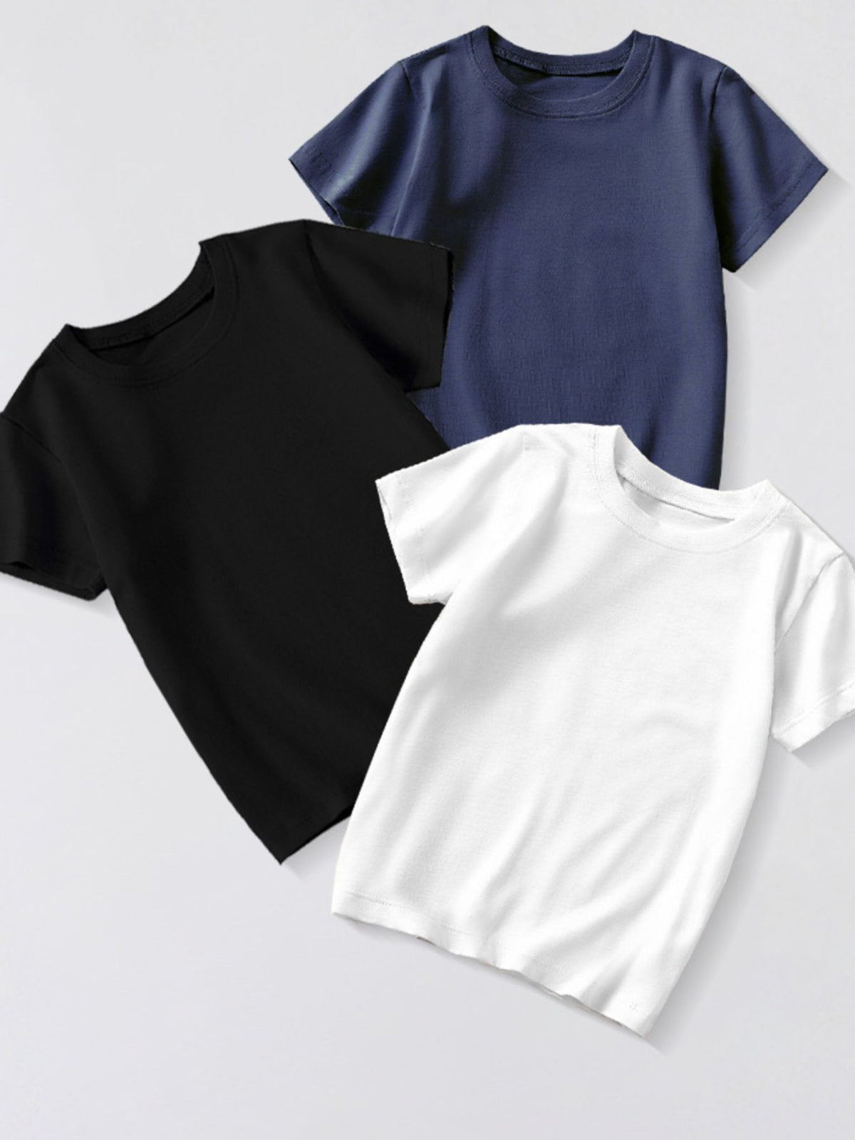 Toddler crew neck t-shirts in black, dark navy, and white cotton.