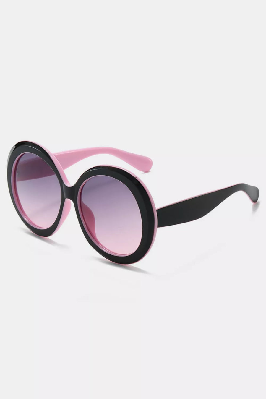 Oversized round sunglasses with black frames, pink temples, and gradient purple lenses.