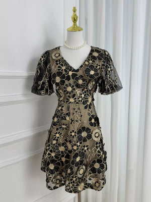 Black floral embroidered mesh dress with short puff sleeves and V-neck.