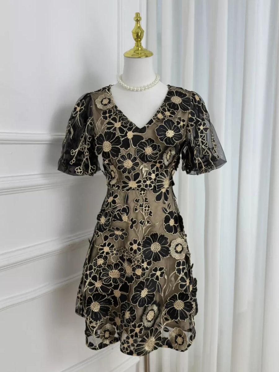 Black floral embroidered mesh dress with short puff sleeves and V-neck.
