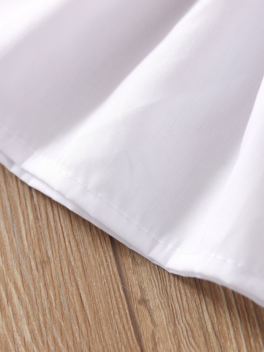 Toddler white cotton ruffle top detail with neat stitching