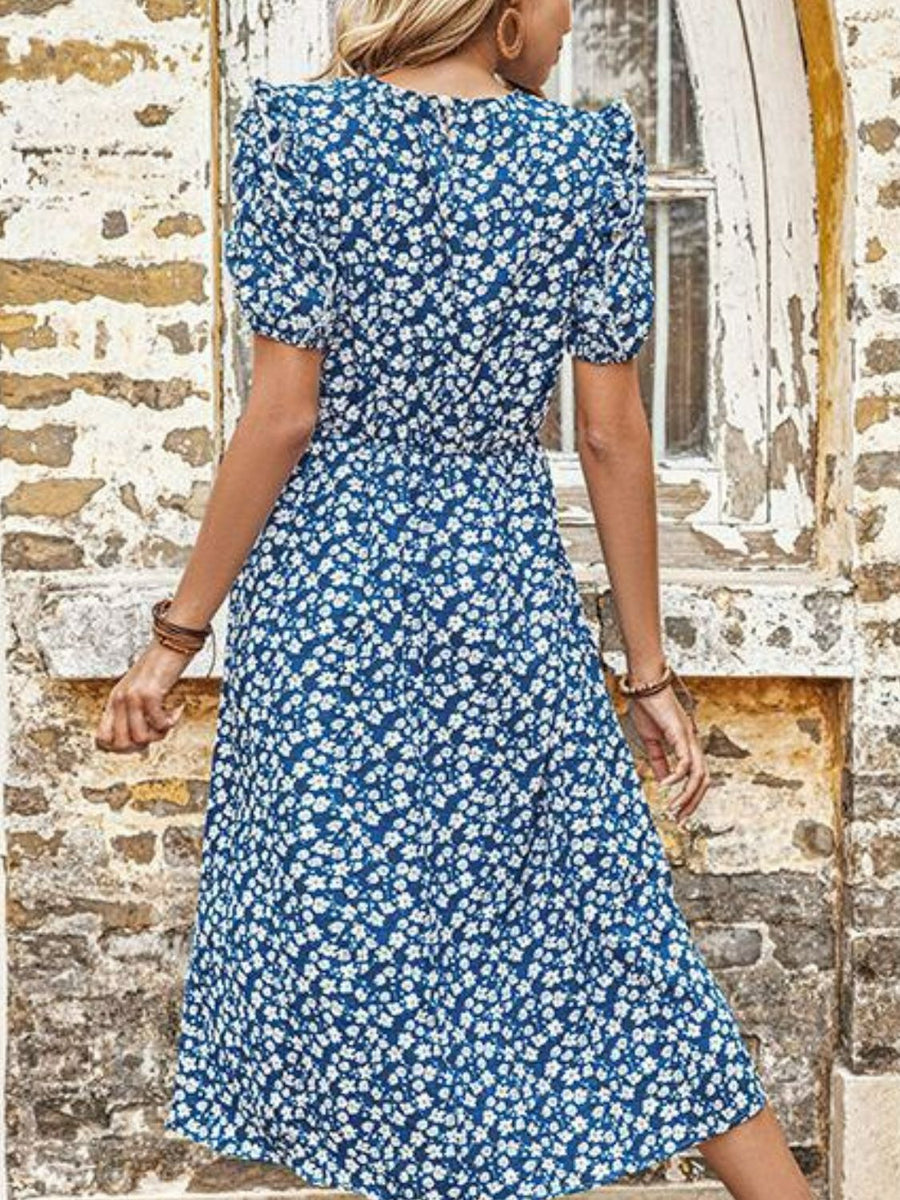 Blue floral midi dress with puff sleeves and a cinched waist