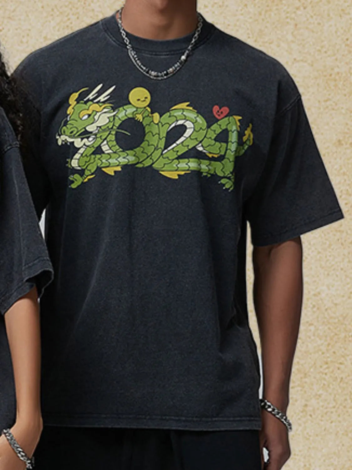 Black washed cotton t-shirt with a green dragon graphic and "2024" text.
