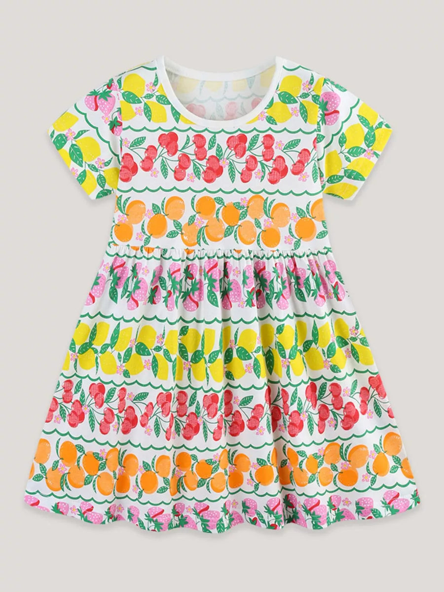 Girls' white short sleeve dress with fruit print, round neck, and ruffled hem.