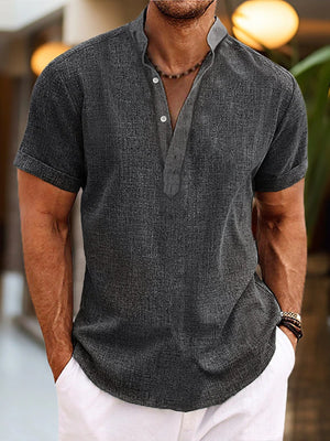Men's gray short sleeve cotton blend henley shirt with button placket and band collar.