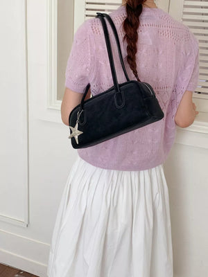 Black shoulder bag with star charm detail