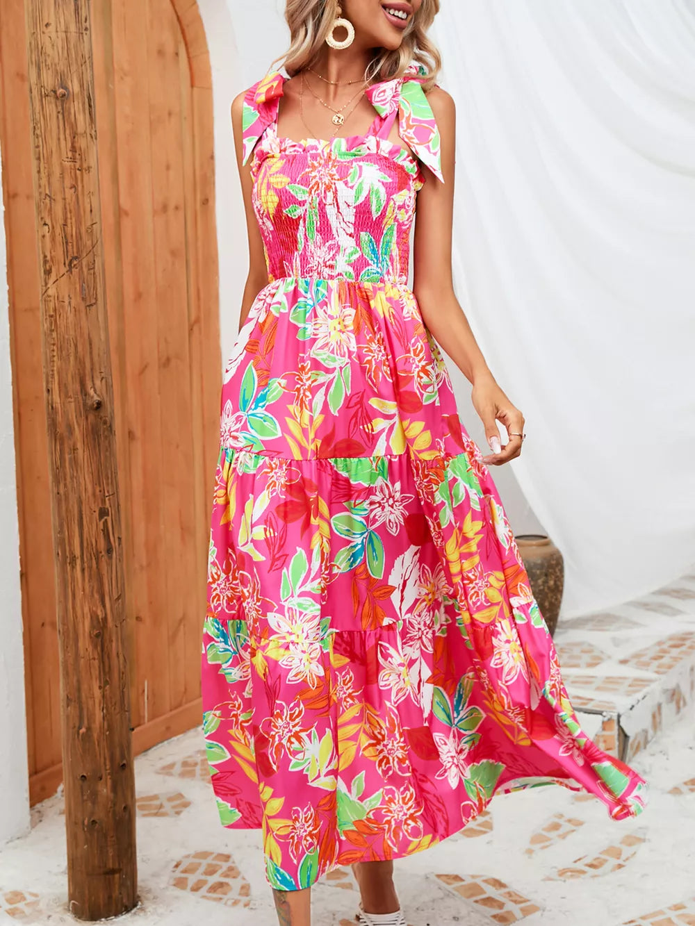 Tropical tie-strap smocked midi dress in strawberry with a tiered floral print skirt.