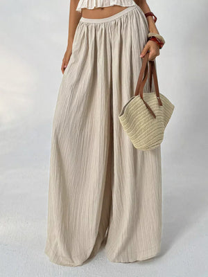 Textured beige maternity pants with wide legs and gathered waist