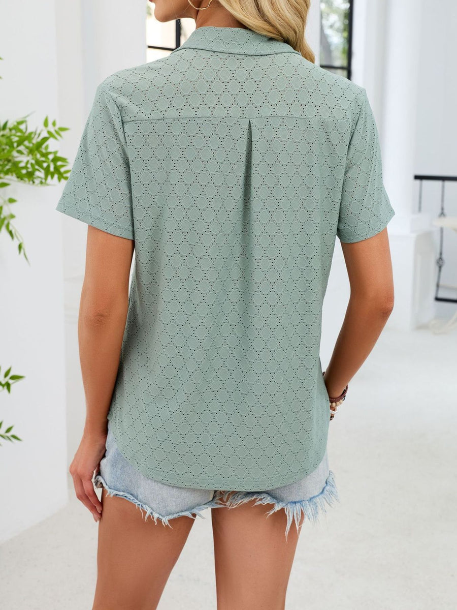 Sage eyelet polo collar blouse with short sleeves and a back pleat detail.