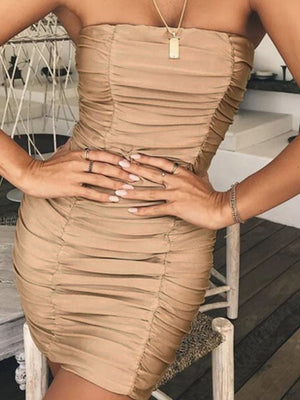 Tan ruched strapless bodycon mini dress with a sweetheart neckline.