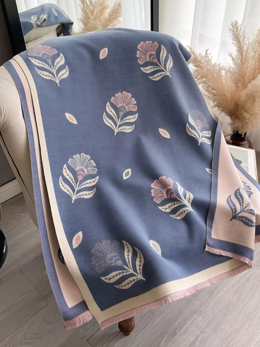 Blue floral print fringed shawl with pink and beige accents, featuring a soft fringe detail.